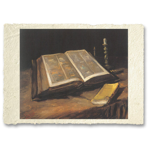 Open Bible with candlestick and novel, Van Gogh. Reproduction